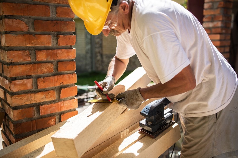 man working on home construction project