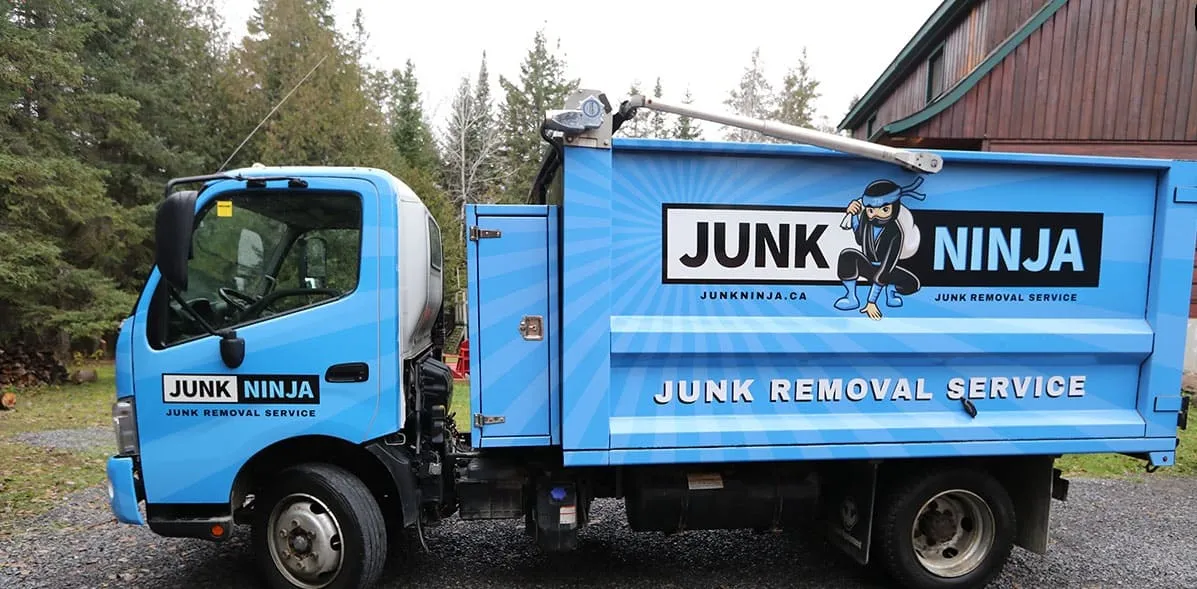 Blue Junk Ninja truck providing junk removal services in Ottawa area